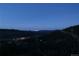 Panoramic night view of city lights from a scenic mountain home at 1295 Hy Vu Dr, Evergreen, CO 80439