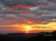 Breathtaking sunset view with colorful clouds over a mountain range, taken on 09/24/2018 at 1295 Hy Vu Dr, Evergreen, CO 80439