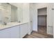 Modern bathroom with double sinks, neutral walls and ample storage space at 15274 Milwaukee St, Thornton, CO 80602
