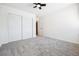 Bedroom with white barn doors and grey carpet at 5102 Williams Fork Trl # 109, Boulder, CO 80301