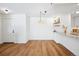 Simple dining area with wood floors and entry to kitchen at 5102 Williams Fork Trl # 109, Boulder, CO 80301