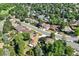 Overhead aerial view of a neighborhood featuring lush trees, single-Gathering homes, and well-maintained streets in a serene setting at 8664 E Monmouth Pl, Denver, CO 80237