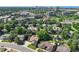 Aerial view of a residential area with lush greenery, well-maintained homes, and convenient access to commercial and recreational spaces at 8664 E Monmouth Pl, Denver, CO 80237