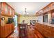 Well-equipped kitchen with custom cabinetry, glass cooktop, and an eat-in bar area at 8664 E Monmouth Pl, Denver, CO 80237