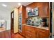 Gourmet kitchen features stainless steel appliances, granite countertops, and custom cabinets at 8664 E Monmouth Pl, Denver, CO 80237
