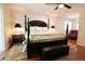 Comfortable main bedroom featuring a spacious layout and a luxurious four-poster bed at 8664 E Monmouth Pl, Denver, CO 80237