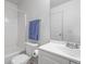 Bright bathroom features a shower and tub combo and a white vanity sink at 892 Macaw St, Brighton, CO 80601