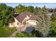 Beautiful aerial view of a well-maintained home surrounded by lush greenery and mature trees at 6524 Surry Pl, Parker, CO 80134