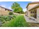 Well-maintained backyard with a paver patio, lush lawn, and garden area at 6524 Surry Pl, Parker, CO 80134