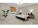 Comfortable bedroom with neutral tones, two side tables, and patterned carpeting at 6524 Surry Pl, Parker, CO 80134