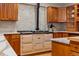 Close up view of a vintage range stove and custom wood cabinets with marble countertops and tiled backsplash at 6524 Surry Pl, Parker, CO 80134