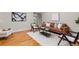 Cozy living room showcasing hardwood floors, natural light, stylish furniture and contemporary decor at 6524 Surry Pl, Parker, CO 80134