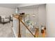 Open loft area overlooking the dining room with hardwood floors and a staircase at 6524 Surry Pl, Parker, CO 80134