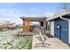 Relaxing backyard includes a pergola-covered patio, hammock, and well-maintained lawn ideal for outdoor enjoyment at 4512 S Yank St, Morrison, CO 80465