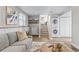 Cozy finished basement featuring a stacked washer/dryer, seating area, and access to stairs at 4512 S Yank St, Morrison, CO 80465