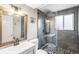 Beautifully updated bathroom with stylish vanity, modern fixtures, and glass enclosed tiled shower at 4512 S Yank St, Morrison, CO 80465