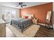 Cozy bedroom with large window, ceiling fan, and natural light, perfect for relaxation at 4512 S Yank St, Morrison, CO 80465