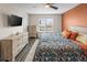 Well-lit bedroom with a ceiling fan, large window, and neutral color palette, a relaxing space at 4512 S Yank St, Morrison, CO 80465