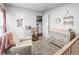 Cozy bedroom with a comfortable chair, dresser, and soft carpeting at 4512 S Yank St, Morrison, CO 80465