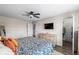 Spacious bedroom featuring a ceiling fan, modern furniture, and a walk-in closet at 4512 S Yank St, Morrison, CO 80465
