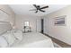Neutral bedroom featuring a ceiling fan, two closets and a framed picture at 4512 S Yank St, Morrison, CO 80465