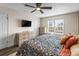 Bright bedroom features a ceiling fan, large windows, and neutral color palette, a peaceful retreat at 4512 S Yank St, Morrison, CO 80465