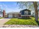 Charming two-story home with brick and dark siding, attached garage, and landscaped front yard at 4512 S Yank St, Morrison, CO 80465