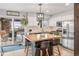 Lovely kitchen with stainless appliances, an eat-in island, and access to the outdoor deck at 4512 S Yank St, Morrison, CO 80465