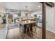 Well-equipped kitchen with a wooden island, stainless steel appliances, and a view of the outdoor deck at 4512 S Yank St, Morrison, CO 80465