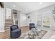 Bright living room featuring modern furniture, large windows, and hardwood floors that create a cozy atmosphere at 4512 S Yank St, Morrison, CO 80465