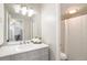 Clean bathroom with white vanity, ample mirror space, and a separate shower/tub area at 955 Eudora Street St # 108E, Denver, CO 80220