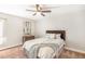 Comfortable bedroom featuring a plush bed, dresser, and a ceiling fan with a light fixture at 955 Eudora Street St # 108E, Denver, CO 80220