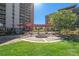Inviting courtyard featuring a pergola, manicured lawn, and seating, perfect for relaxing and enjoying the outdoors at 955 Eudora Street St # 108E, Denver, CO 80220