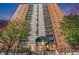 Striking high-rise with brick facade, concrete accents, and multiple balconies at 955 Eudora Street St # 108E, Denver, CO 80220