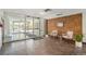 Building lobby featuring glass doors, brick accent walls, neutral seating, and a tile floor at 955 Eudora Street St # 108E, Denver, CO 80220
