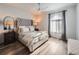 Bright bedroom with a comfortable bed and en-suite laundry at 3351 S Monaco Pkwy # F, Denver, CO 80222