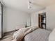Bedroom with a large bed and access to the laundry room at 3351 S Monaco Pkwy # F, Denver, CO 80222