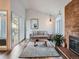 Open living room with hardwood floors, fireplace and neutral decor at 3351 S Monaco Pkwy # F, Denver, CO 80222