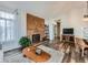 Living room with hardwood floors, fireplace and built-in shelving at 3351 S Monaco Pkwy # F, Denver, CO 80222