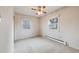 Bright bedroom featuring hardwood floors and ample natural light at 401 S Oak St, Lakewood, CO 80226