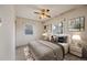 Main bedroom with a neutral color scheme and ceiling fan at 401 S Oak St, Lakewood, CO 80226