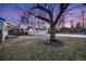 Home's backyard showcasing a detached garage at 401 S Oak St, Lakewood, CO 80226