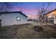 Side view of a single-car garage and yard at 401 S Oak St, Lakewood, CO 80226