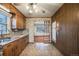 Retro kitchen with wood cabinets and tiled floor at 401 S Oak St, Lakewood, CO 80226