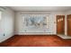 Bright living room with large windows and brown carpet at 401 S Oak St, Lakewood, CO 80226