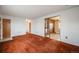 Open living room with view into kitchen and hallway at 401 S Oak St, Lakewood, CO 80226