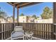 Outdoor balcony with seating, offering a relaxing space with views of the surrounding community at 9995 E Harvard Ave # 224, Denver, CO 80231
