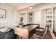 Bedroom featuring a large desk, closet, and neutral color scheme at 9995 E Harvard Ave # 224, Denver, CO 80231