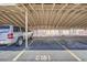 Assigned carport with parking spot number offers covered parking for residents at 9995 E Harvard Ave # 224, Denver, CO 80231