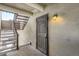 Building entrance featuring stairs and a secure door leading to the units at 9995 E Harvard Ave # 224, Denver, CO 80231